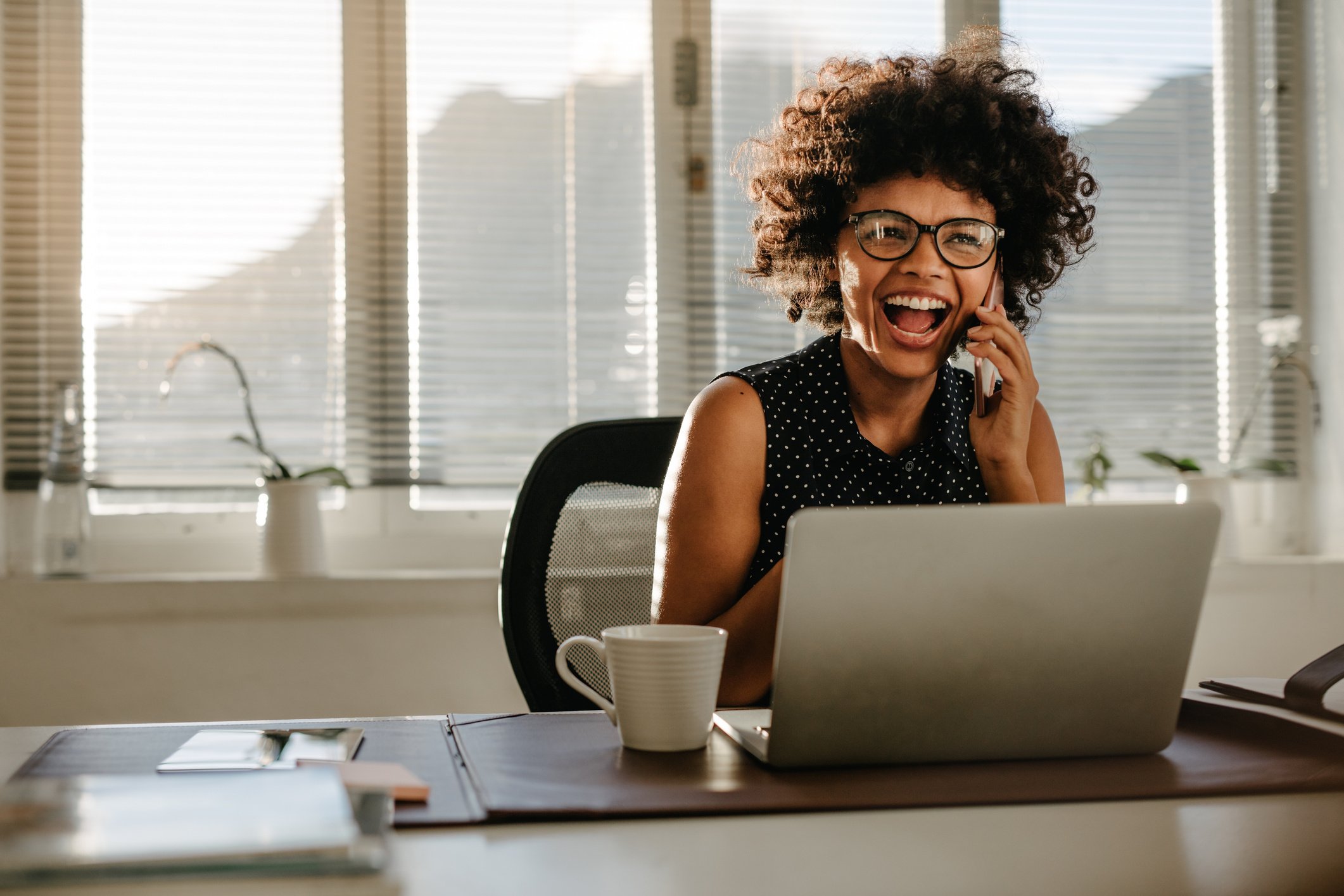 Woman on a Phone Call at the Office 